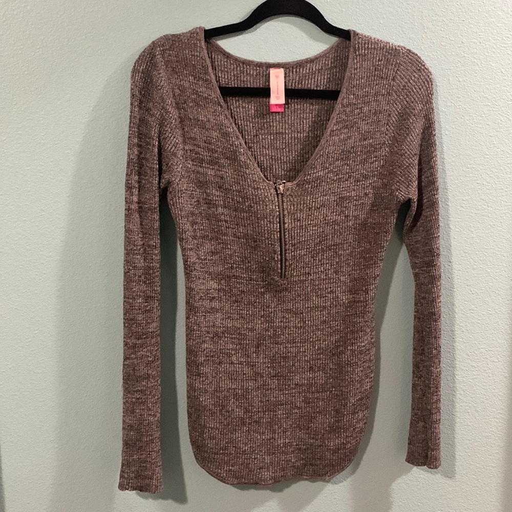 Grey tight long sleeve shirt.